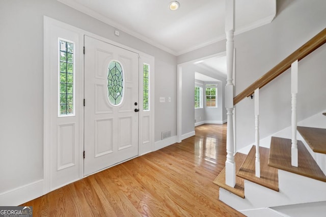4197 Chadds Xing, Marietta, GA 30062 - entrance foyer with light wood-style flooring, crown molding, stairs, and baseboards