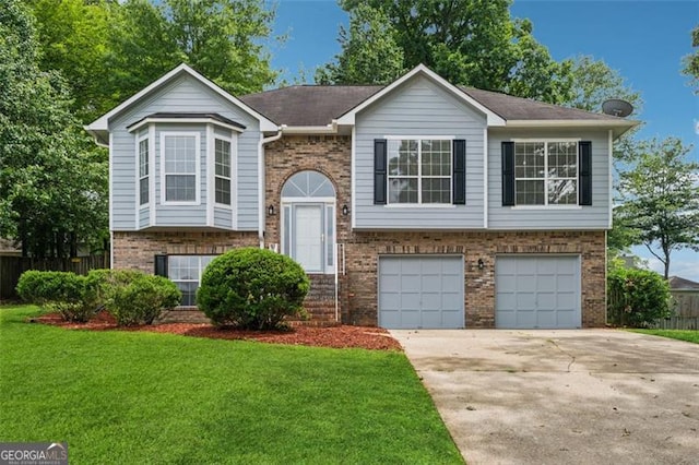 12290 Greenmont Walk, Alpharetta, GA 30009 - split foyer home featuring brick siding, an attached garage, and driveway
