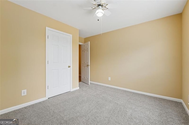 12290 Greenmont Walk, Alpharetta, GA 30009 - unfurnished bedroom with carpet, baseboards, and ceiling fan