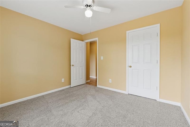 12290 Greenmont Walk, Alpharetta, GA 30009 - unfurnished bedroom featuring carpet, baseboards, and a ceiling fan