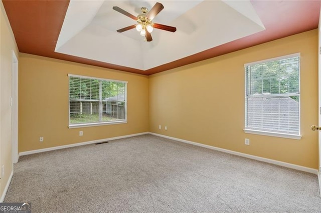 12290 Greenmont Walk, Alpharetta, GA 30009 - carpeted spare room with a raised ceiling, a ceiling fan, and baseboards
