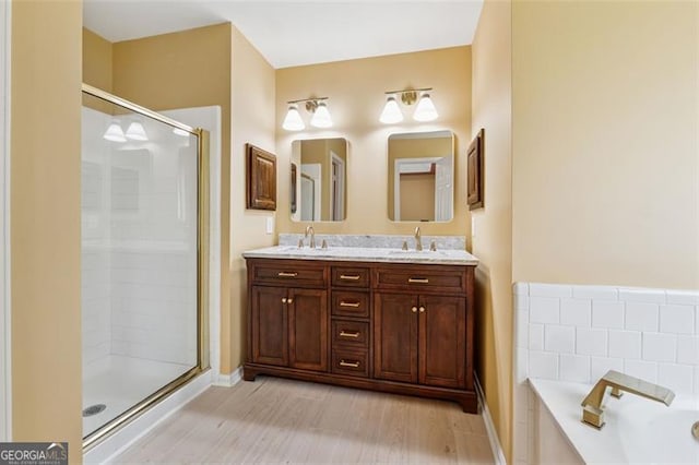 12290 Greenmont Walk, Alpharetta, GA 30009 - bathroom with a stall shower, double vanity, a bath, and baseboards