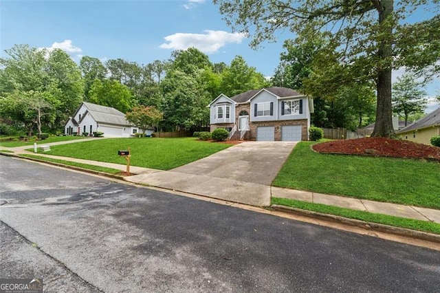 12290 Greenmont Walk, Alpharetta, GA 30009 - raised ranch featuring a front yard, a garage, and driveway
