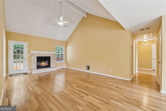 12290 Greenmont Walk, Alpharetta, GA 30009 - unfurnished living room with attic access, a ceiling fan, light wood-style floors, high vaulted ceiling, and beam ceiling