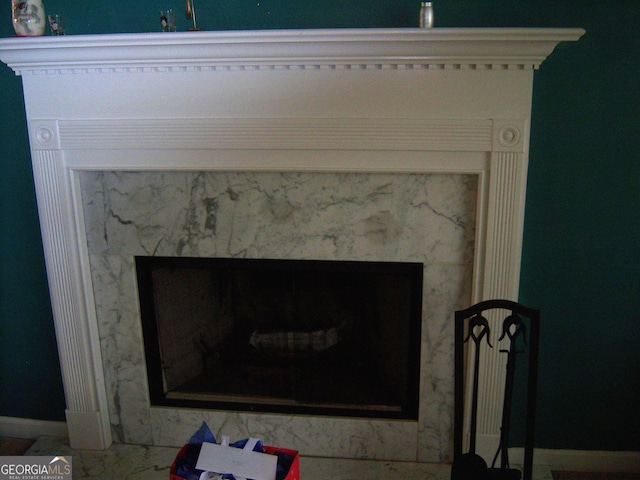 225 Long Creek Dr, Covington, GA 30016 - detailed view of baseboards and a fireplace