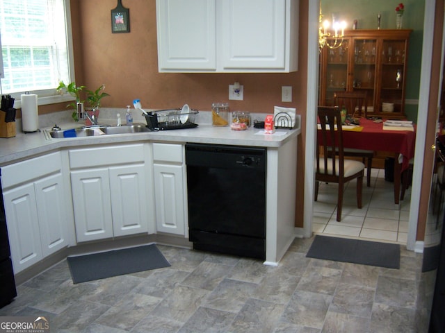 225 Long Creek Dr, Covington, GA 30016 - kitchen featuring black dishwasher, a chandelier, white cabinets, and light countertops