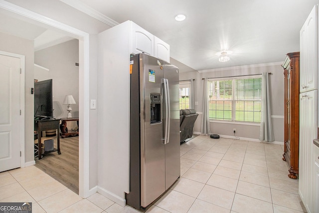 325 Leonard Rd, Lagrange, GA 30241 - kitchen featuring stainless steel refrigerator with ice dispenser, baseboards, light tile patterned flooring, crown molding, and white cabinetry
