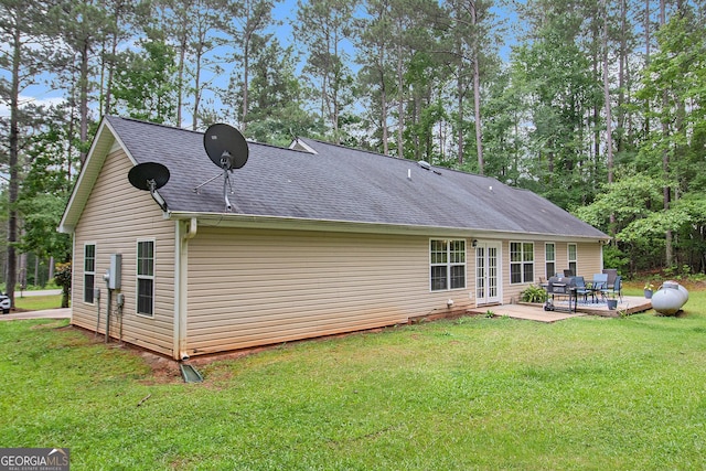 325 Leonard Rd, Lagrange, GA 30241 - rear view of property featuring french doors, a yard, a patio area, and a shingled roof