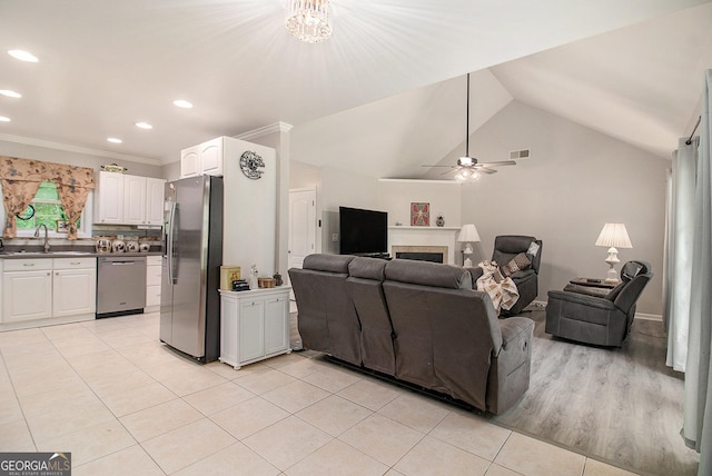 325 Leonard Rd, Lagrange, GA 30241 - living room featuring a tiled fireplace, light tile patterned floors, lofted ceiling, recessed lighting, and ornamental molding