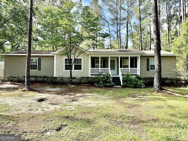 179 Creek Ridge Rd, Claxton, GA 30417 - ranch-style home featuring covered porch and a front lawn