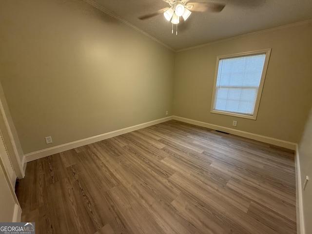 179 Creek Ridge Rd, Claxton, GA 30417 - spare room with crown molding, a ceiling fan, wood finished floors, and baseboards