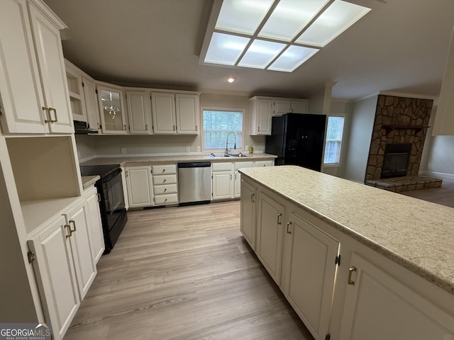 179 Creek Ridge Rd, Claxton, GA 30417 - kitchen featuring black appliances, a sink, crown molding, light countertops, and white cabinetry