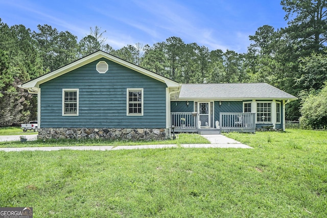 2969 White Rd NE, Conyers, GA 30012 - ranch-style home featuring a front lawn and a deck