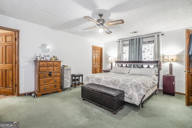 2969 White Rd NE, Conyers, GA 30012 - carpeted bedroom featuring a textured ceiling and ceiling fan