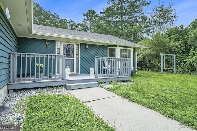 2969 White Rd NE, Conyers, GA 30012 - doorway to property featuring roof with shingles and a lawn