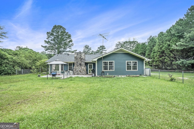 2969 White Rd NE, Conyers, GA 30012 - rear view of house featuring a fenced backyard, a gazebo, and a patio area