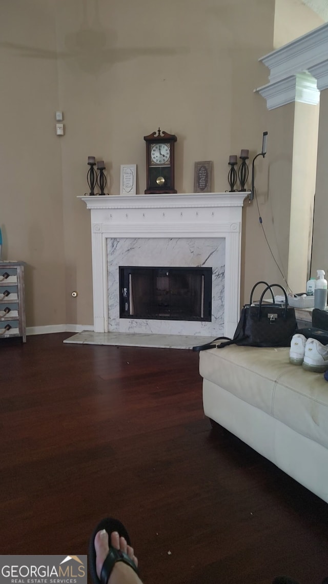 85 Bermuda Run Dr, Covington, GA 30016 - living area featuring a high end fireplace and wood finished floors