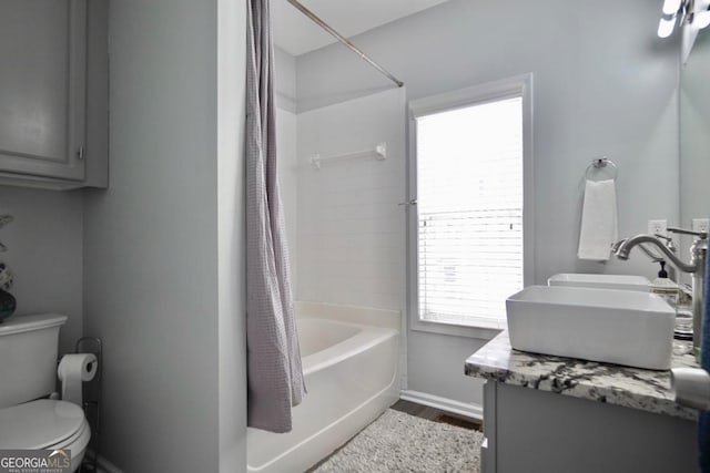 5996 Eagle Tiff Ln, Sugar Hill, GA 30518 - bathroom featuring double vanity, shower / bath combo with shower curtain, and wood finished floors