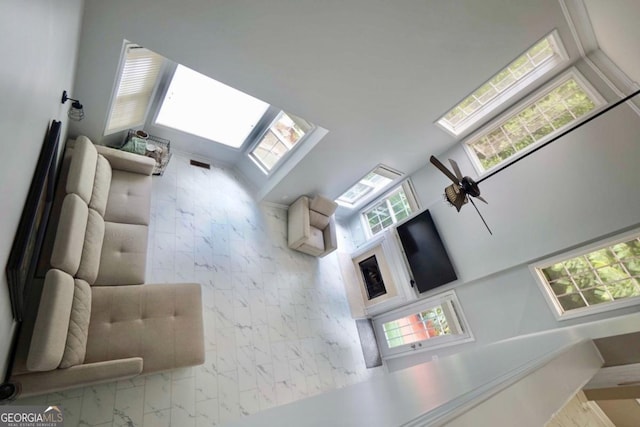 5996 Eagle Tiff Ln, Sugar Hill, GA 30518 - living room with plenty of natural light, marble finish floors, and a towering ceiling