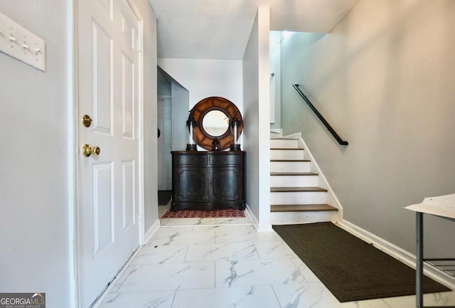 5996 Eagle Tiff Ln, Sugar Hill, GA 30518 - foyer featuring marble look tile flooring and stairs