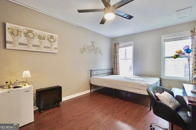 5996 Eagle Tiff Ln, Sugar Hill, GA 30518 - bedroom with dark wood-style flooring and a ceiling fan