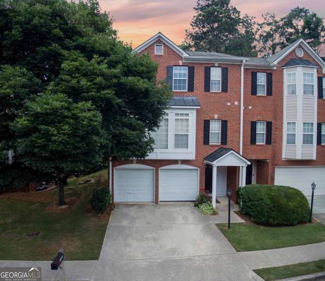 5996 Eagle Tiff Ln, Sugar Hill, GA 30518 - view of front facade featuring driveway, a garage, and brick siding