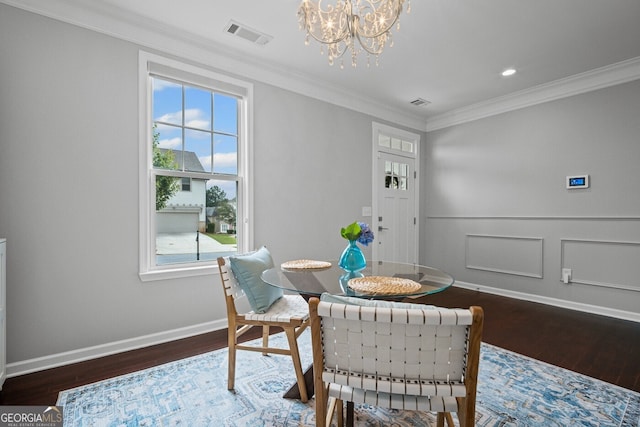 149 Archie Way, Woodstock, GA 30188 - dining area featuring wood finished floors, crown molding, a chandelier, and baseboards