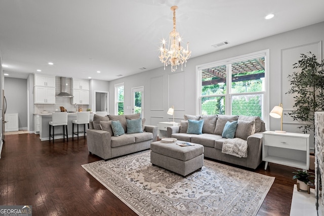 149 Archie Way, Woodstock, GA 30188 - living area featuring a chandelier, dark wood-type flooring, and recessed lighting