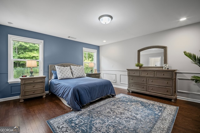 149 Archie Way, Woodstock, GA 30188 - bedroom featuring wood finished floors, a wainscoted wall, and a decorative wall