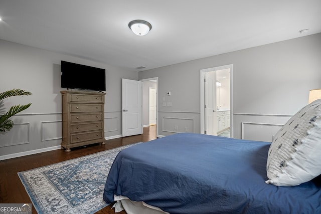 149 Archie Way, Woodstock, GA 30188 - bedroom with wood finished floors, wainscoting, a decorative wall, and ensuite bathroom