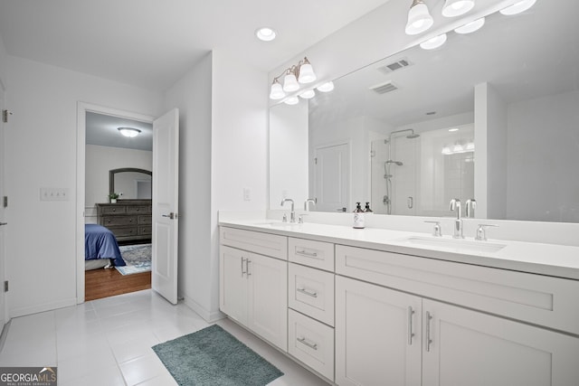 149 Archie Way, Woodstock, GA 30188 - ensuite bathroom featuring a stall shower, double vanity, tile patterned floors, baseboards, and recessed lighting