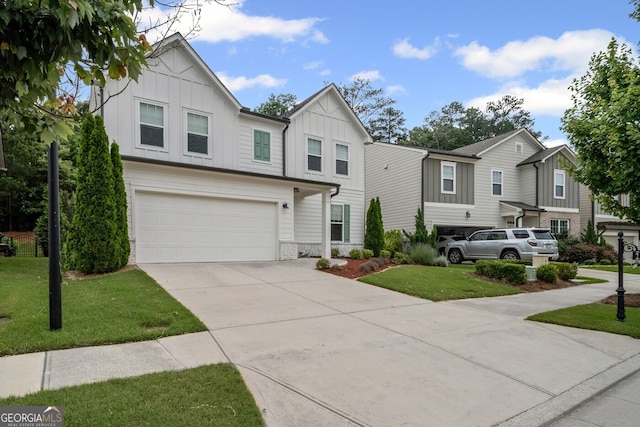 149 Archie Way, Woodstock, GA 30188 - view of front of property featuring board and batten siding, a garage, concrete driveway, and a front yard
