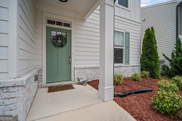 149 Archie Way, Woodstock, GA 30188 - property entrance with a porch, stone siding, and board and batten siding