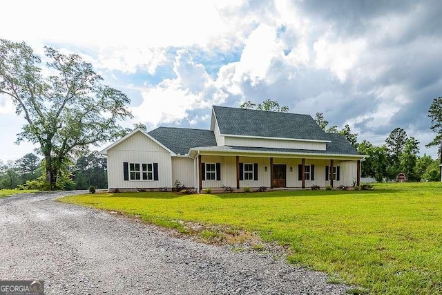 408 Mock St, Sylvania, GA 30467 - view of front of home with roof with shingles, a front lawn, covered porch, and driveway