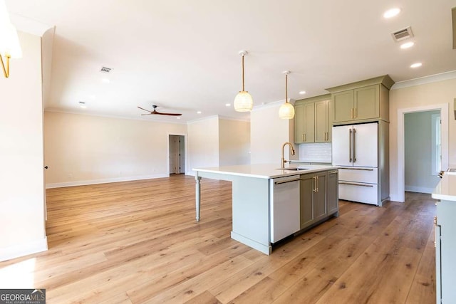 408 Mock St, Sylvania, GA 30467 - kitchen featuring high end white refrigerator, a sink, dishwasher, ornamental molding, and recessed lighting