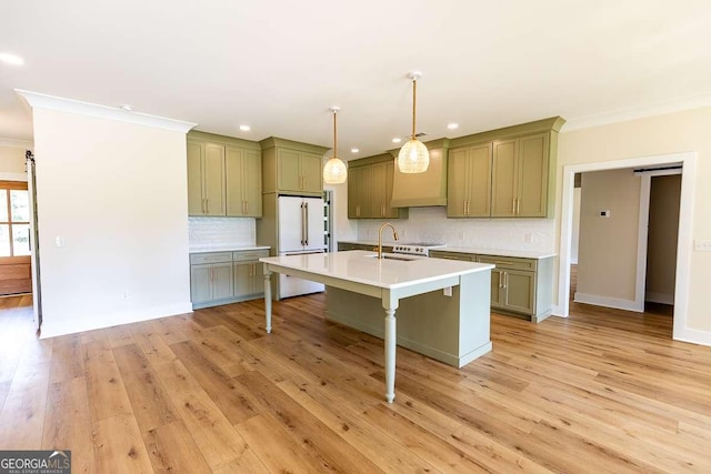 408 Mock St, Sylvania, GA 30467 - kitchen featuring high end white refrigerator, a breakfast bar, tasteful backsplash, crown molding, and light countertops