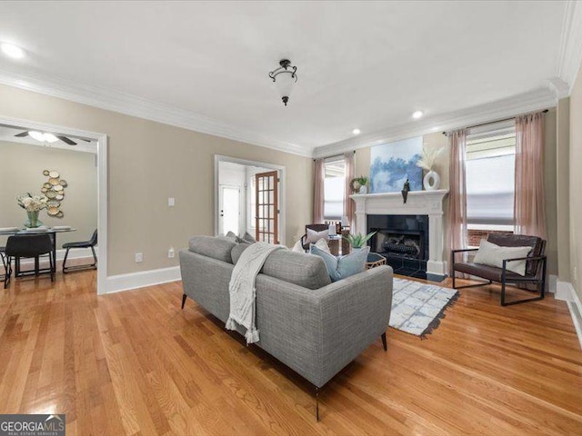 121 Fulton Way SE, Atlanta, GA 30312 - living area featuring plenty of natural light, crown molding, a tiled fireplace, light wood-style floors, and recessed lighting