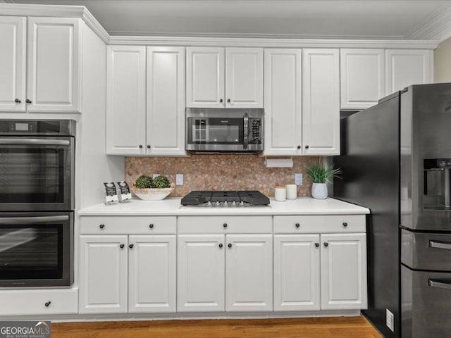 121 Fulton Way SE, Atlanta, GA 30312 - kitchen with appliances with stainless steel finishes, light countertops, and white cabinets