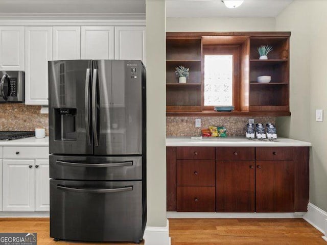 121 Fulton Way SE, Atlanta, GA 30312 - kitchen with appliances with stainless steel finishes, open shelves, light countertops, and tasteful backsplash