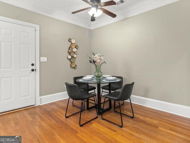 121 Fulton Way SE, Atlanta, GA 30312 - dining area with ornamental molding, ceiling fan, light wood-type flooring, and baseboards