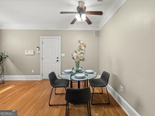 121 Fulton Way SE, Atlanta, GA 30312 - dining area with ornamental molding, light wood-style floors, baseboards, and ceiling fan