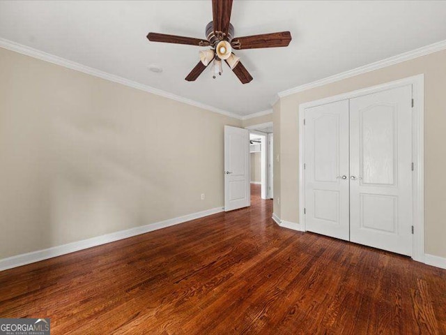 121 Fulton Way SE, Atlanta, GA 30312 - unfurnished bedroom featuring dark wood finished floors, baseboards, crown molding, a closet, and a ceiling fan