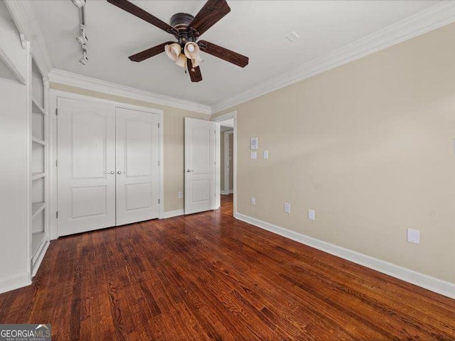 121 Fulton Way SE, Atlanta, GA 30312 - unfurnished bedroom featuring wood finished floors, a closet, baseboards, crown molding, and a ceiling fan