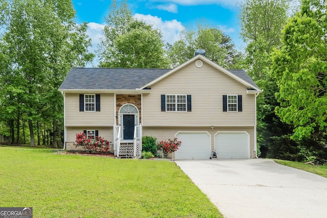 236 Fairview Dr, Dallas, GA 30157 - split foyer home with an attached garage, concrete driveway, a front yard, and roof with shingles