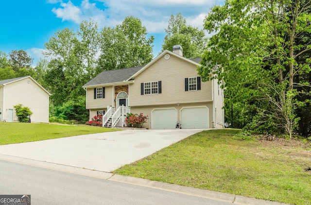 236 Fairview Dr, Dallas, GA 30157 - raised ranch with an attached garage, driveway, a chimney, and a front yard