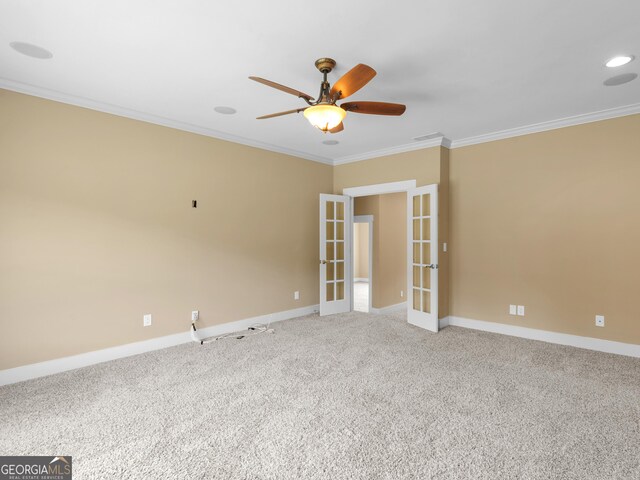 3905 Pointer Rd, Loganville, GA 30052 - empty room with french doors, ornamental molding, ceiling fan, and light carpet