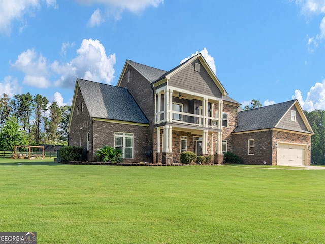 3905 Pointer Rd, Loganville, GA 30052 - view of front of property with a front yard, brick siding, a ceiling fan, and a balcony