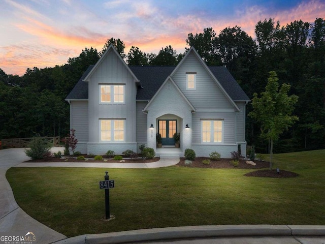 8415 Azure Overlook Trl, Gainesville, GA 30506 - view of front of house with board and batten siding, a yard, and french doors
