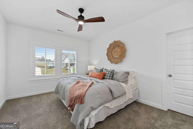 8415 Azure Overlook Trl, Gainesville, GA 30506 - bedroom featuring carpet floors, baseboards, and a ceiling fan