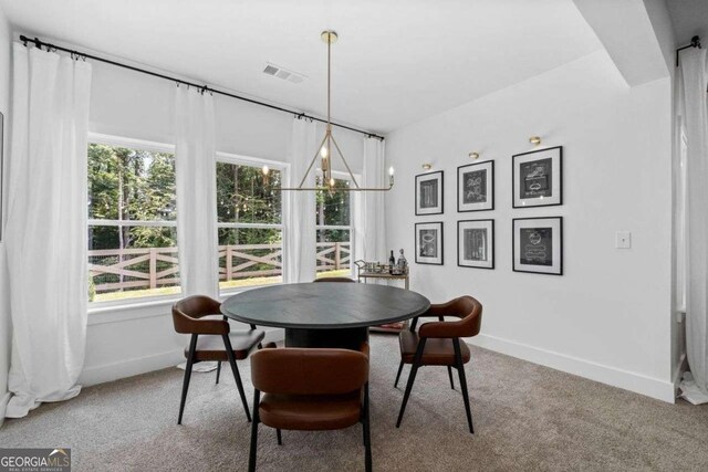 8415 Azure Overlook Trl, Gainesville, GA 30506 - carpeted dining space with baseboards and a chandelier